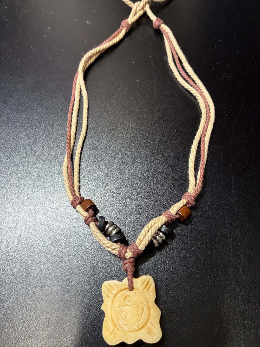 Handmade Beige and Brown Cord Necklace with Carved Pendant